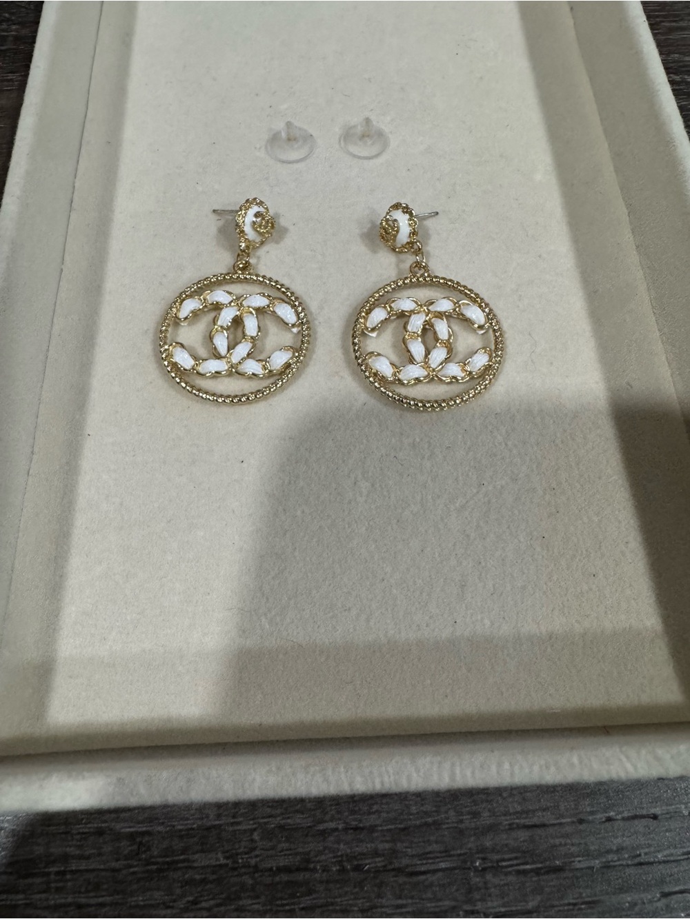 White & gold earrings